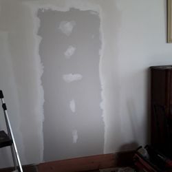 Wayne's Handyman Service - Drywall over a doorway.