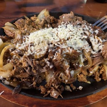 Los Portales Minocqua - Carnitas, chorizo, grilled onions - served with beans, rice and tortillas. - Mexican Near Me - Minocqua, Wisconsin Los Portales Minocqua - Carnitas, chorizo, grilled onions - served with beans, rice and tortillas. - Mexican Near Me - Minocqua, Wisconsin