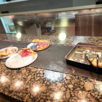 Stevi B's Pizza Buffet - pizzas being prepared - Pizza Near Me - Stockbridge, Georgia