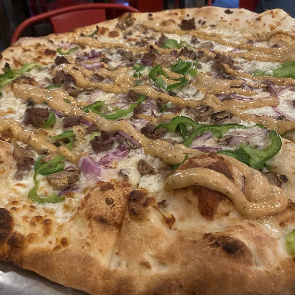 Neighbor's Kitchen & Yard - Large Ground Philly pizza - Pizza Near Me - Bastrop, Texas