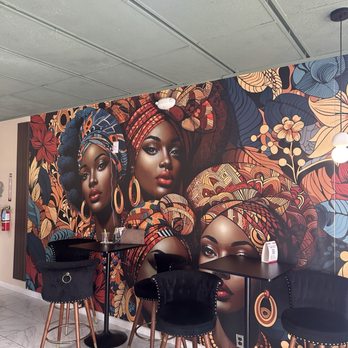 Crepes On Main - High top seating next to the low couch seating area and mural - Cafes Near Me - Laurel, Maryland