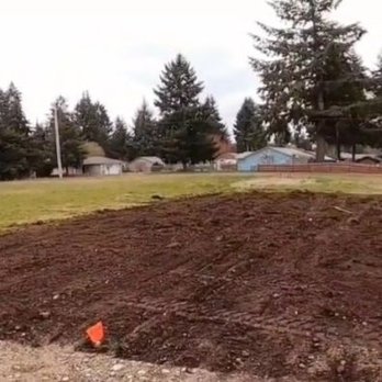 Reliable Earthwork Innovations - Back yard, high grade slope leveled, and French drains completed. - Excavation Services Near Me