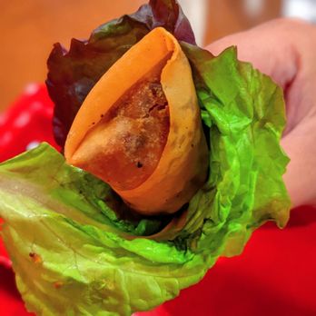 Love Pho - a hand holding a sandwich with lettuce - Vietnamese Near Me - El Paso, Texas