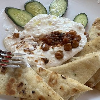 Cyra's - Simple Goodness - Feta spread with tomato ham and chickpeas. Served with cucumbers and naan. - New American Near Me - Dalton, Georgia Cyra's - Simple Goodness - Feta spread with tomato ham and chickpeas. Served with cucumbers and naan. - New American Near Me - Dalton, Georgia