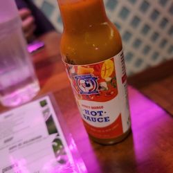 The Freakin Rican - House hot sauce. Tasty with a mango tang