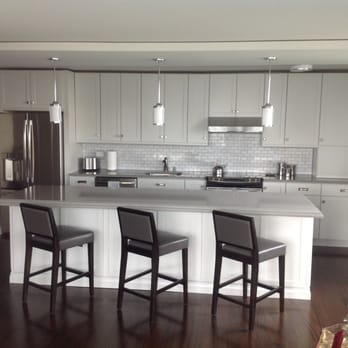 Masterpiece Kitchens - a kitchen with a christmas tree - General Contractors Near Me