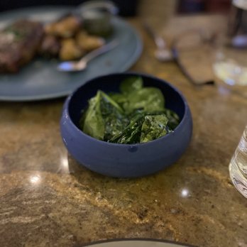 One Iron Bar - a plate of food and a glass of water - Bars Near Me - San Martin, California