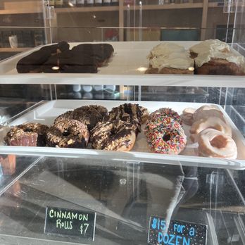 Lucy's - Chocolate custard long John, cinnamon roll, sour cream glazed, sprinkle, peanut and chocolate Reese's, and heath bar doughnuts. - Coffee & Tea Near Me - Grand Rapids, Michigan Lucy's - Chocolate custard long John, cinnamon roll, sour cream glazed, sprinkle, peanut and chocolate Reese's, and heath bar doughnuts. - Coffee & Tea Near Me - Grand Rapids, Michigan