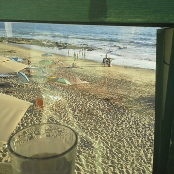 Driftwood Kitchen - view from our table before the sunset, those little umbrella tops to the left are tables at The Deck - Seafood Near Me - Laguna Beach, California Driftwood Kitchen - view from our table before the sunset, those little umbrella tops to the left are tables at The Deck - Seafood Near Me - Laguna Beach, California