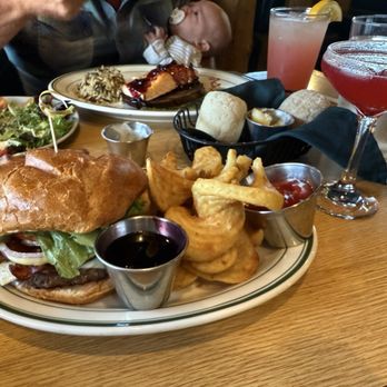 Three Bear Restaurant - burger with fries + side of huckleberry bbq sauce and huckleberry lemon drop martini - American Near Me - West Yellowstone, Montana