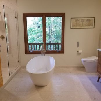 Styles and Tiles - a bathtub in a bathroom - Flooring Near Me - Naples, Florida Styles and Tiles - a bathtub in a bathroom - Flooring Near Me - Naples, Florida