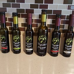 Capella's Oil & Vinegar Store - My collection so far! Black cherry, Sicilian lemon, A premium and pineapple balsamics along with my Tuscan herb and mushroom olive oils!
