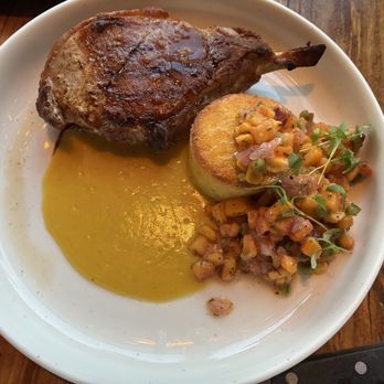 Breadery - Pork rib chop with peach maple bourbon sauce peach and corn salsa baked polenta cake herbs - Italian Near Me - Crested Butte, Colorado