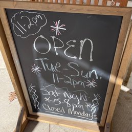 a chalk board with the words open a chalk board with the words open