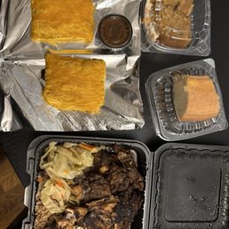 Meat patties, rum cake, carrot cake, half chicken half oxtail rice beans and cabbage Meat patties, rum cake, carrot cake, half chicken half oxtail rice beans and cabbage