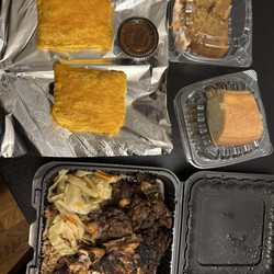 The Jerk Pit - Meat patties, rum cake, carrot cake, half chicken half oxtail rice beans and cabbage