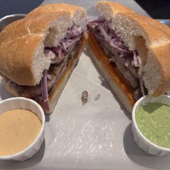 Sangucheria - Chicharron Sandwich with pork, yams, and marinated red onions. - Sandwiches Near Me - San Diego, California Sangucheria - Chicharron Sandwich with pork, yams, and marinated red onions. - Sandwiches Near Me - San Diego, California