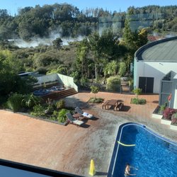 Holiday Inn Rotorua - View from our room of the lovely pool and geothermal features behind the hotel.