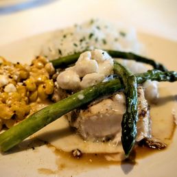 Swordfish Oscar topped with lump crab, side of Mexican street corn, asparagus, and steamed rice. Excellent.