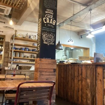 The Scallop Shell - View into the kitchen from our booth. - Fish & Chips Near Me - Bath, BAS