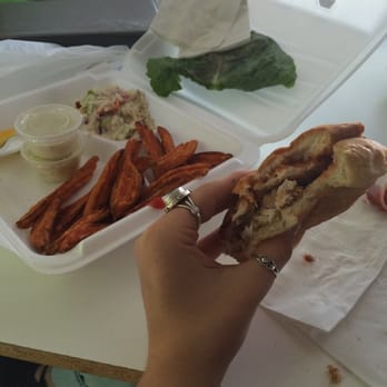 The Pickled Herring - Whitefish sandwich with sweet potato fries to go. So delicious! - American Near Me - Bayfield, Wisconsin
