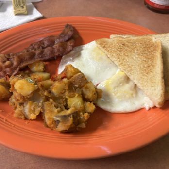 Louis’ Deli - Breakfast Plate with two eggs over medium, bacon and potatoes - Delis Near Me - Houston, Texas Louis’ Deli - Breakfast Plate with two eggs over medium, bacon and potatoes - Delis Near Me - Houston, Texas
