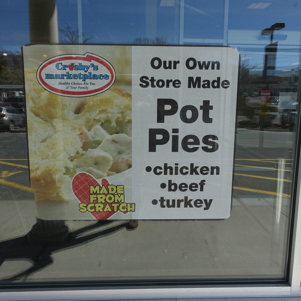 Crosbys Marketplace - a sign in the window of a store - Grocery Near Me - Georgetown, Massachusetts