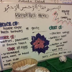 New Africa Cafe - Menu.  Choose one from each section or two meats if you get the combo.  An order of chicken wings is worth it.
