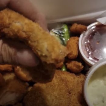 Gyro's Drive Inn - a hand holding a fried chicken sandwich - Seafood Near Me - San Antonio, Texas Gyro's Drive Inn - a hand holding a fried chicken sandwich - Seafood Near Me - San Antonio, Texas