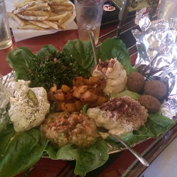 Ranoush - Vegetarian mezza for two. Note the aluminum foil bird it was served upon. If we were vegetarians this might have been upsetting. - Middle Eastern Near Me - Saint Louis, Missouri
