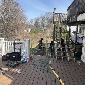 Cornerstone Construction and Remodeling - a man standing on a deck - General Contractors Near Me - Durham, Connecticut