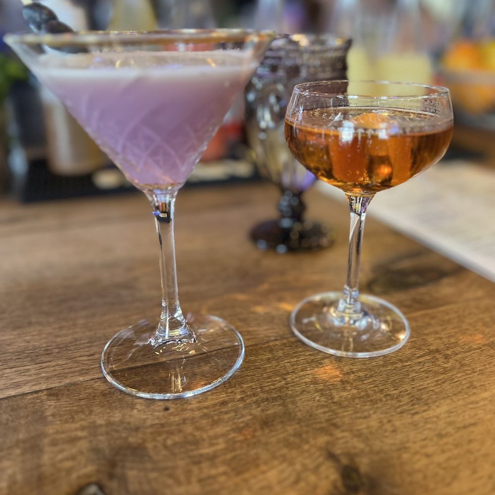 West Side Tavern - two cocktails on a bar - Gastropubs Near Me - Longmont, Colorado West Side Tavern - two cocktails on a bar - Gastropubs Near Me - Longmont, Colorado