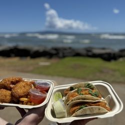 Kihei Fish House by Maui Grill  - Coconut shrimp and fried mahi tacos. At Kalama park across the street beach front .