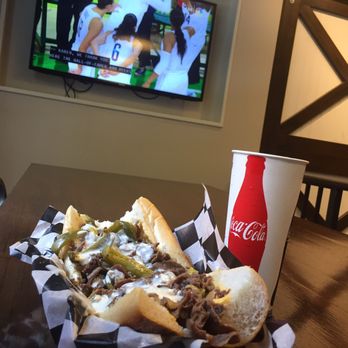 Cleavers - Nice large table with a TV and view of 18th street behind - Cheesesteaks Near Me - Philadelphia, Pennsylvania