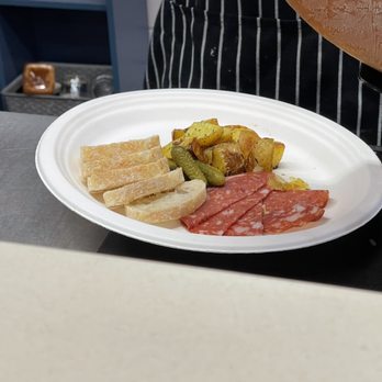 Orrman's Cheese Shop - The potatoes with charcuterie awaiting the raclette. That Toscana salami was scrumptious. - Cheese Shops Near Me - Charlotte, North Carolina Orrman's Cheese Shop - The potatoes with charcuterie awaiting the raclette. That Toscana salami was scrumptious. - Cheese Shops Near Me - Charlotte, North Carolina