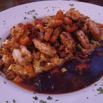 Tibby's New Orleans Kitchen - Shrimp and grits topped with crayfish - Cajun/Creole Near Me - Winter Park, Florida Tibby's New Orleans Kitchen - Shrimp and grits topped with crayfish - Cajun/Creole Near Me - Winter Park, Florida
