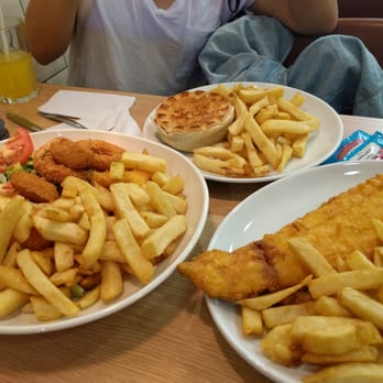 Laughing Halibut - Mixed platter with scampi, cod, calamari, chips and onion rings; liver and steak pie with chips; and large portion of cod and chips - Fish & Chips Near Me - London, XGL