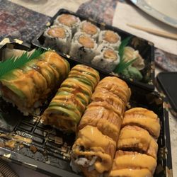 Bento Asian Cuisine - Spicy Tuna Roll (back), Monkey Roll (left), and Salmon Lover Roll (right).