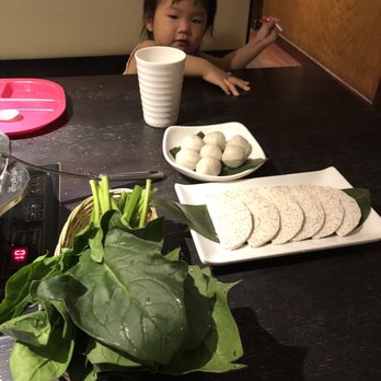 First Lamb Shabu - a little girl sitting at a table - Hot Pot Near Me - Flushing, New York