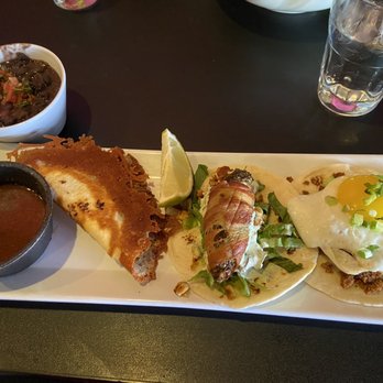 Jefe's Tacos & Tequila - Birria, bacon wrapped jalepeno and chorizo and egg taco with a side of vegan black beans. - Tacos Near Me - Longmont, Colorado
