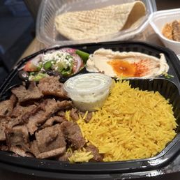 $15.99 gyro plate with pita bread, Greek salad, hummus ,yellow rice, tzatziki sauce