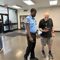 West Covina DMV Office - Peyton in the light blue shirt helping another customer with an android and my phone is an iPhone so he's really hustling!!!