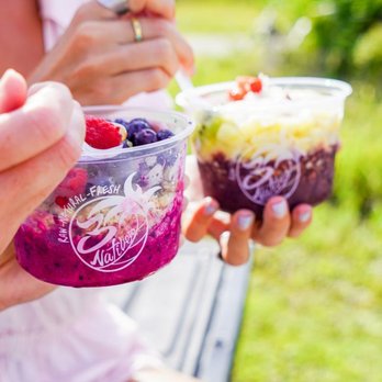 3Natives - a woman eating a bowl of fruit and yogurt - Acai Bowls Near Me - Delray Beach, Florida 3Natives - a woman eating a bowl of fruit and yogurt - Acai Bowls Near Me - Delray Beach, Florida