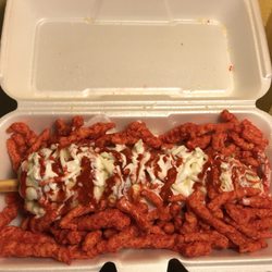 Jenny's Ice cream & Snacks - Corn on the cob with hot Cheetos.