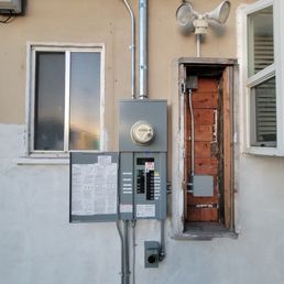 New (surface mount) upgraded 200 Amp Panel, A New 50 Amp, 14-50 inlet for a Generator Backup, whole house surge protection