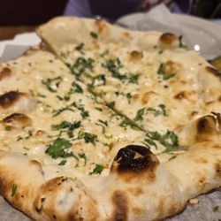 India Garden - Their garlic naan is absolutely amazing -- soft, fresh from the oven, and so flavorful that it just melts in your mouth instantly.