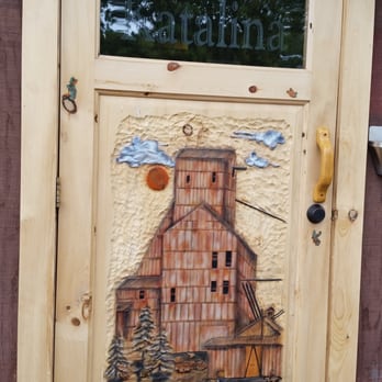 Tina’s Katalina - Wood carving of Quincy Mine on Katalina Cafe door. - Hotels Near Me - South Range, Michigan Tina’s Katalina - Wood carving of Quincy Mine on Katalina Cafe door. - Hotels Near Me - South Range, Michigan
