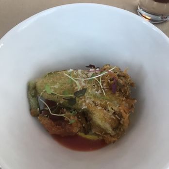 Perry St - tempura squash blossom after they pour the tomato vinaigrette right in front of you! - New American Near Me - New York, New York Perry St - tempura squash blossom after they pour the tomato vinaigrette right in front of you! - New American Near Me - New York, New York