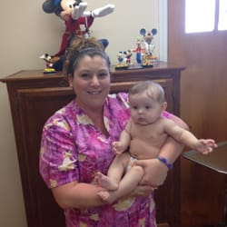 Bart Barrett, MD - Alisa and one of our babies. Alisa has been with the office since 2002!