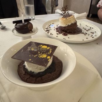 Ponte Modern American - Bottom: Chocolate Soufflé Top Right: Chocolate Trifle Top Left: Birthday Dessert - New American Near Me - Tampa, Florida Ponte Modern American - Bottom: Chocolate Soufflé Top Right: Chocolate Trifle Top Left: Birthday Dessert - New American Near Me - Tampa, Florida